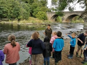 Pupils learning about fishing on the Ribble