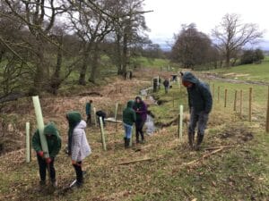 Students from Bowland School helping to plant trees with Ribble Rivers Trust