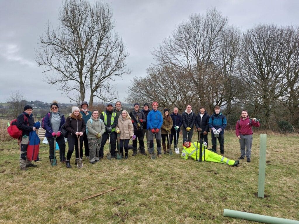 A photo showing staff from Glasdon tree planting on a team away day