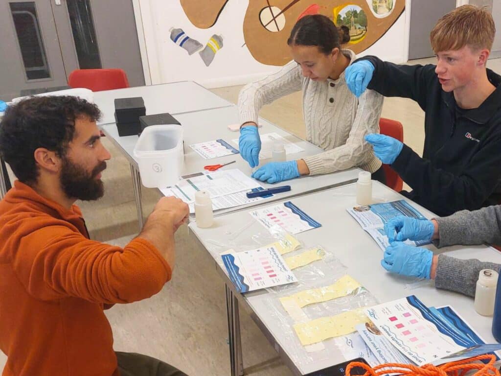 A riverblitz in action- citizen science volunteers process their samples to extract data