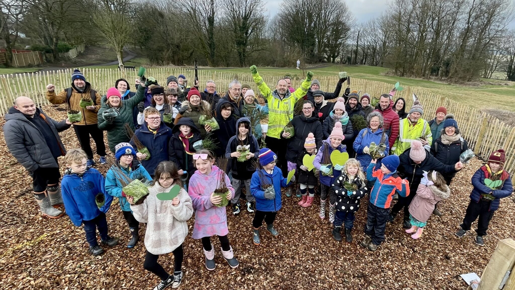 Young people planting trees with Lancashire County Council- one of members of the Lancashire Woodland Partnership